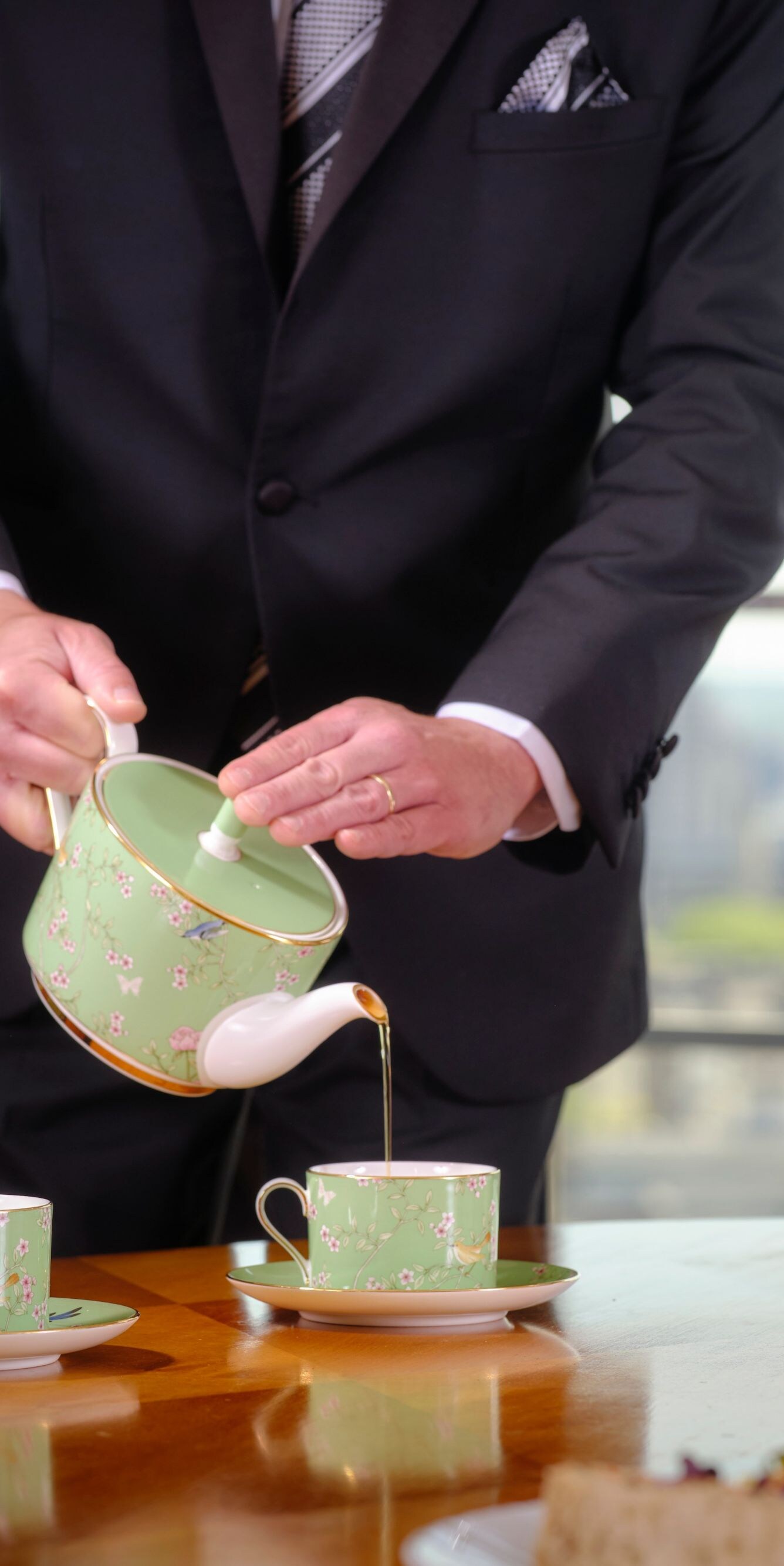 The Park Tower Butler serving afternoon tea to the room