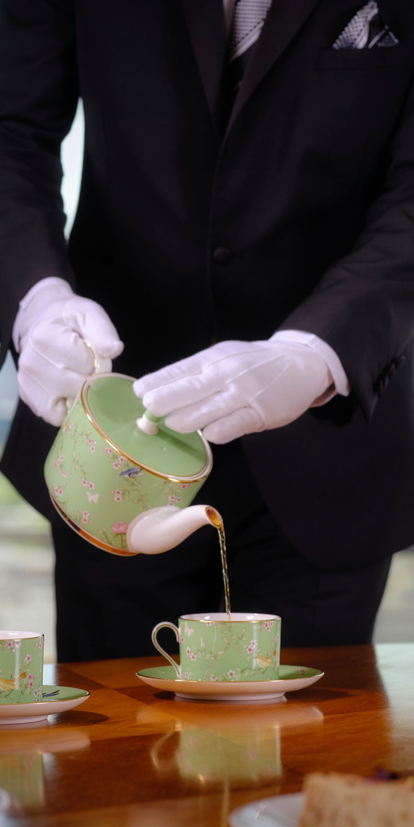 The Park Tower Butler serving afternoon tea to the room