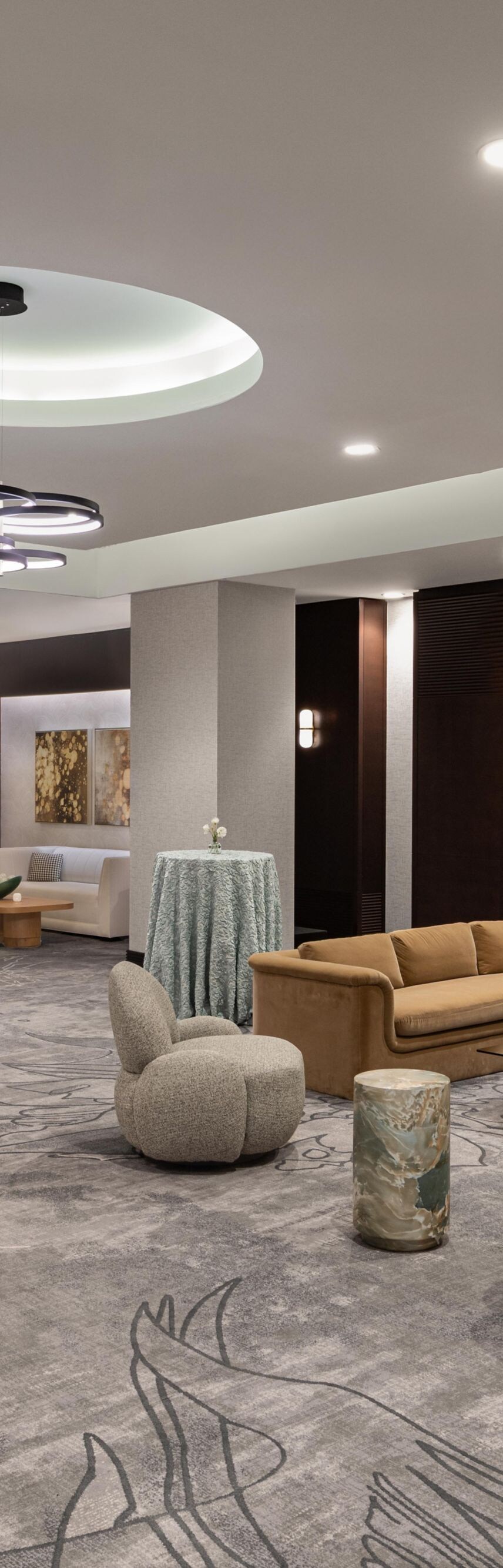 Open room with couches, tables, fire place, and a 