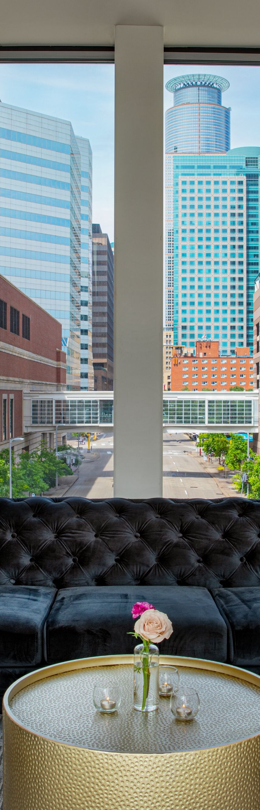 Couches and table with city in the background