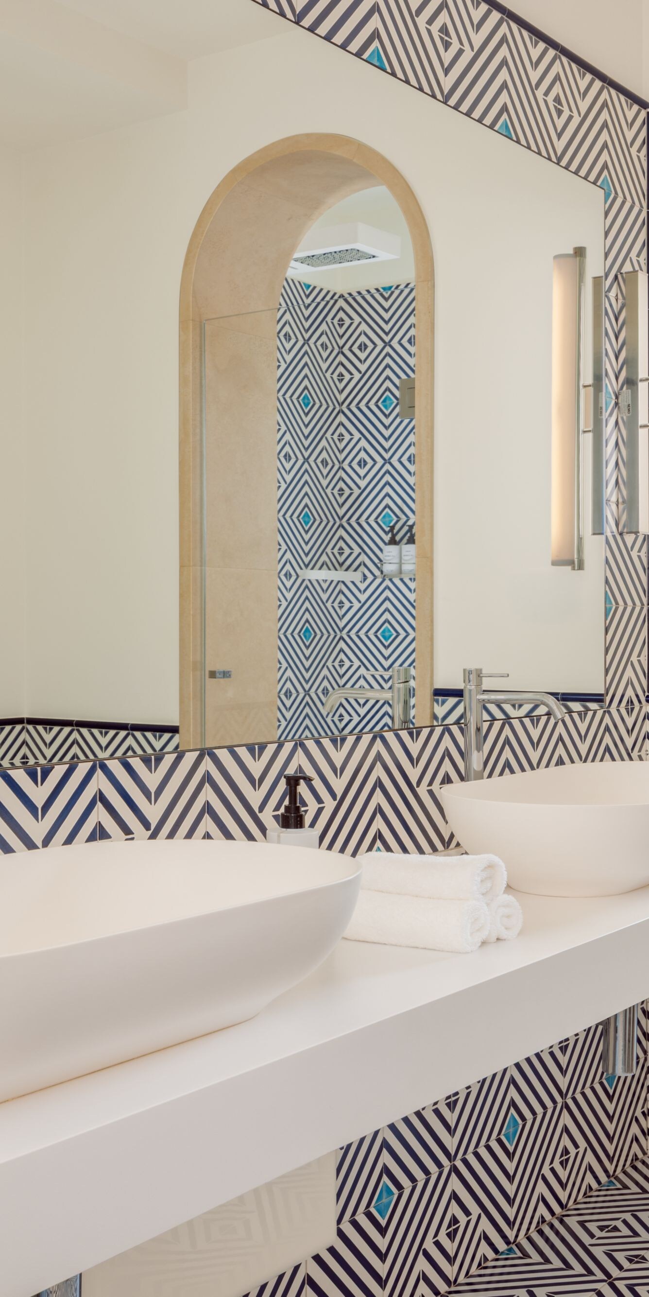 Double vanity bathroom with patterned tile accents
