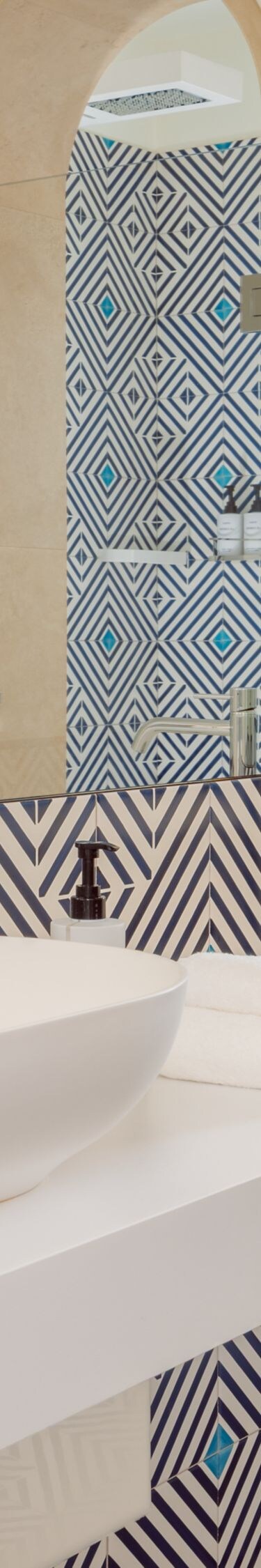 Double vanity bathroom with patterned tile accents