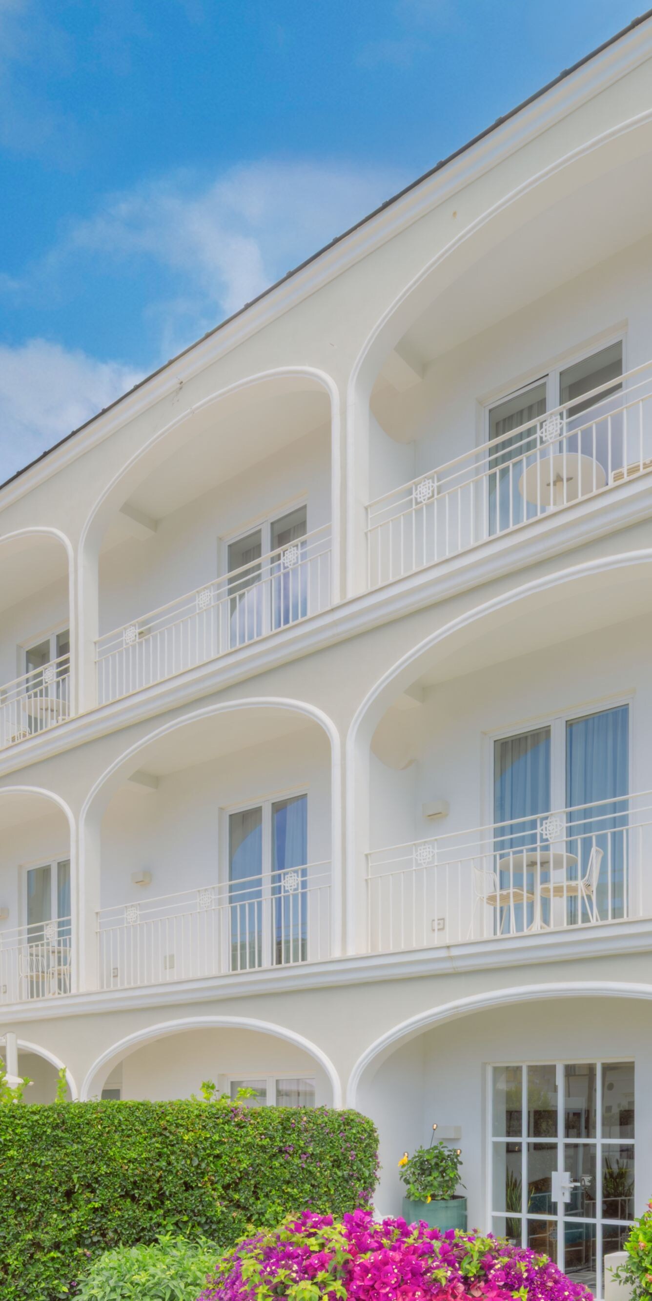 Exterior of building with balconies and gardens