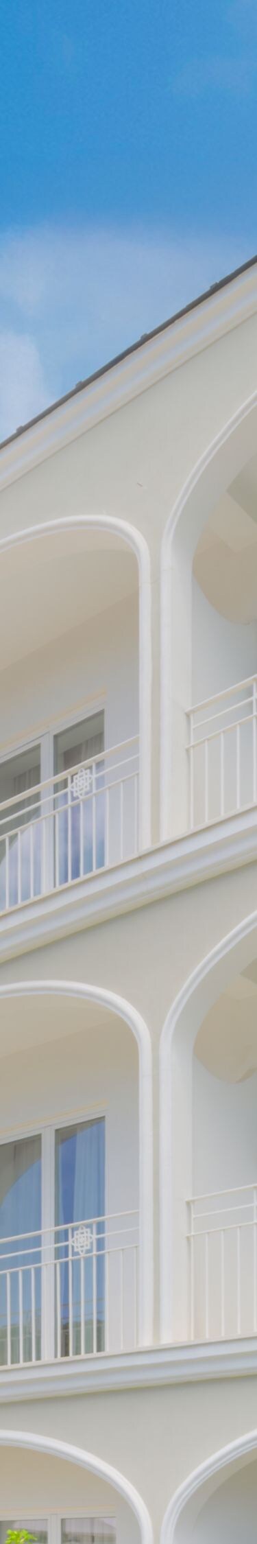 Exterior of building with balconies and gardens