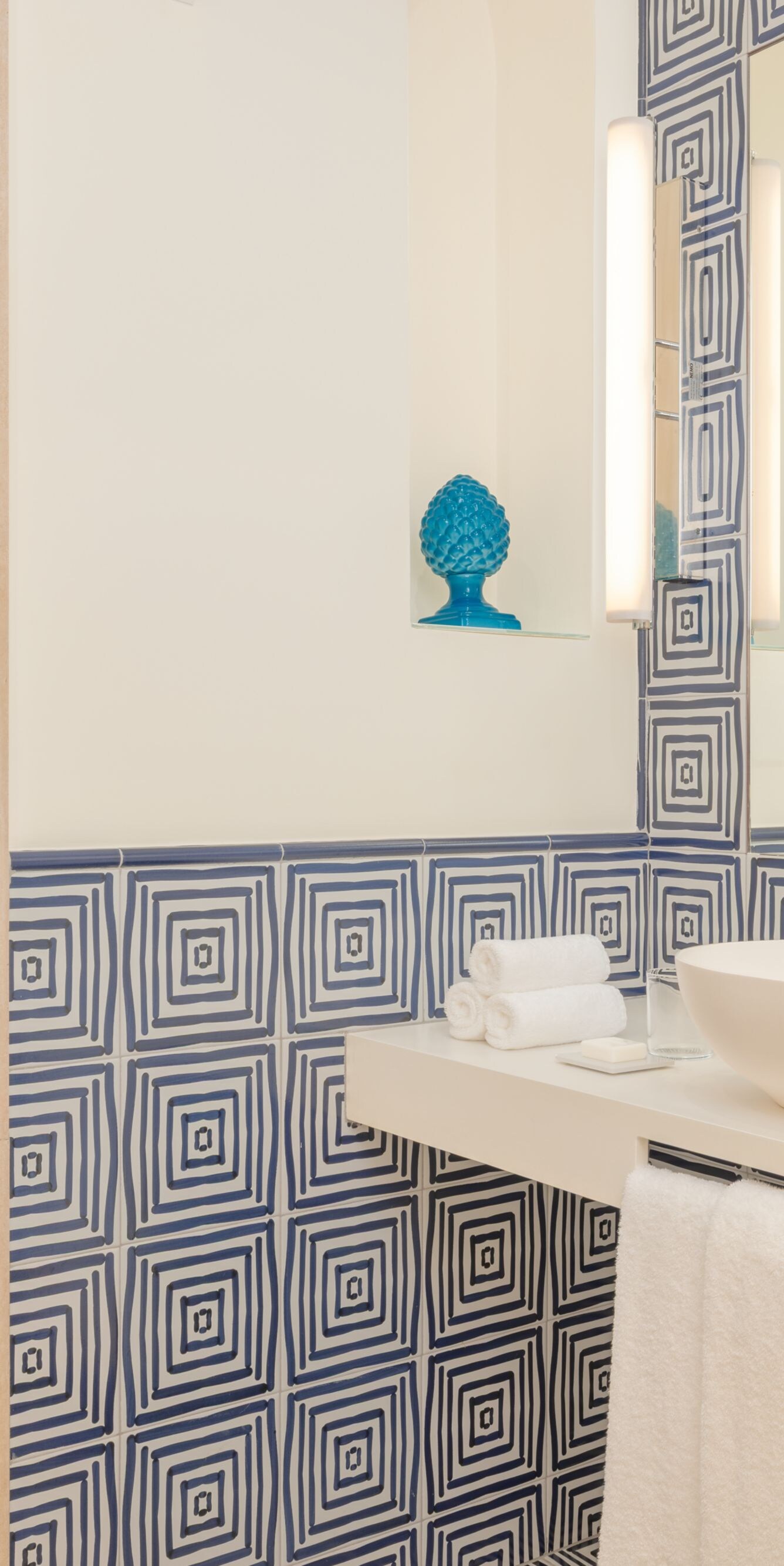 Blue patterned bathroom with walk-in shower