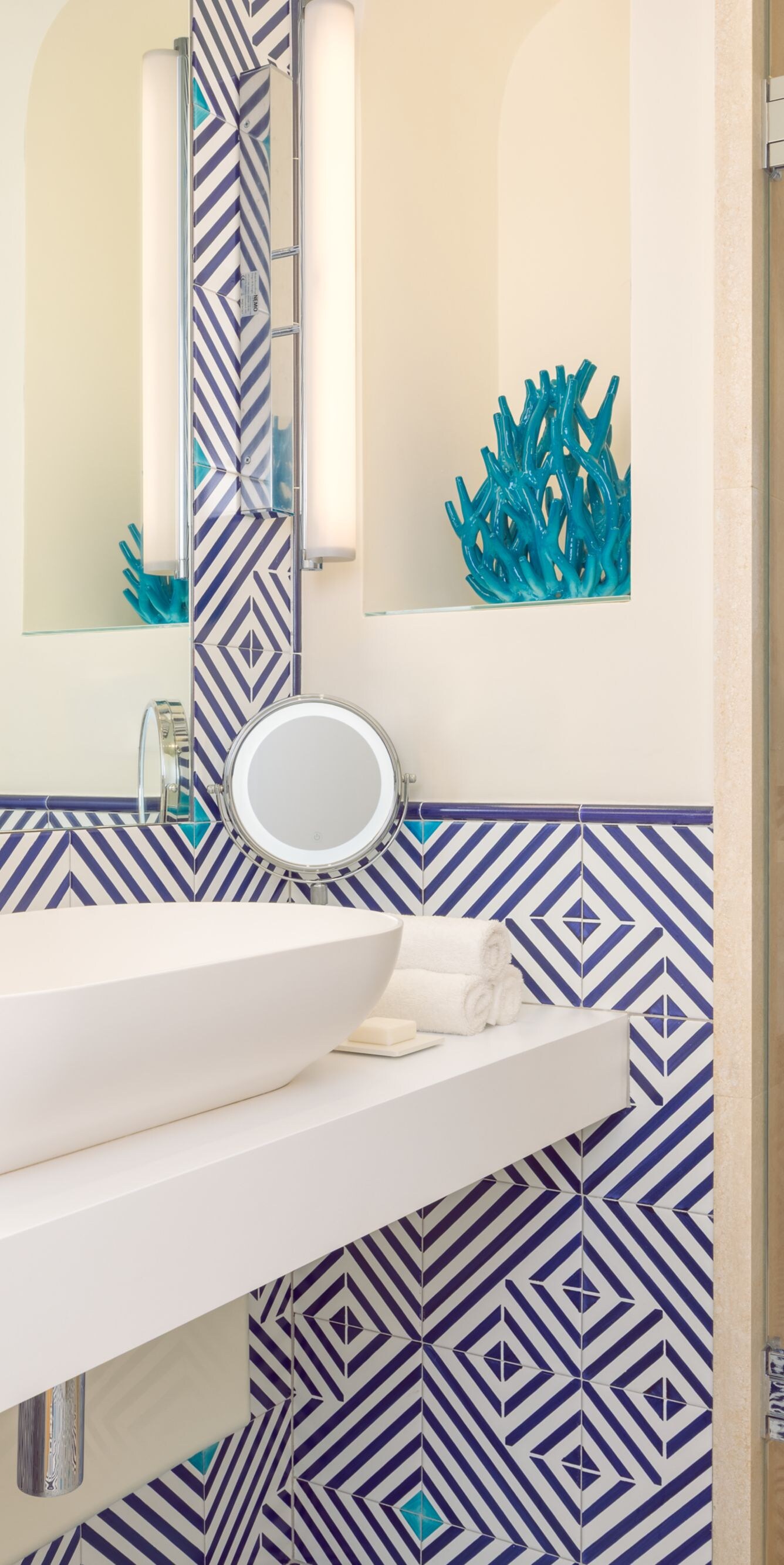 Blue patterned bathroom with vanity and shower