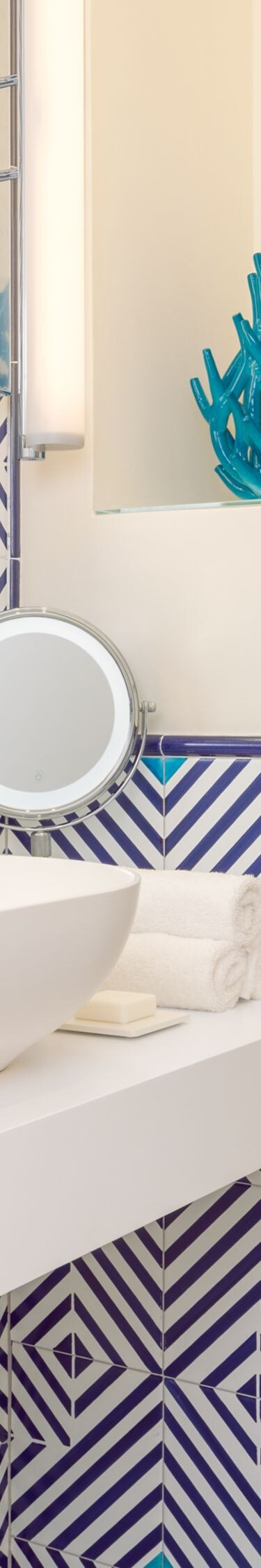 Blue patterned bathroom with vanity and shower