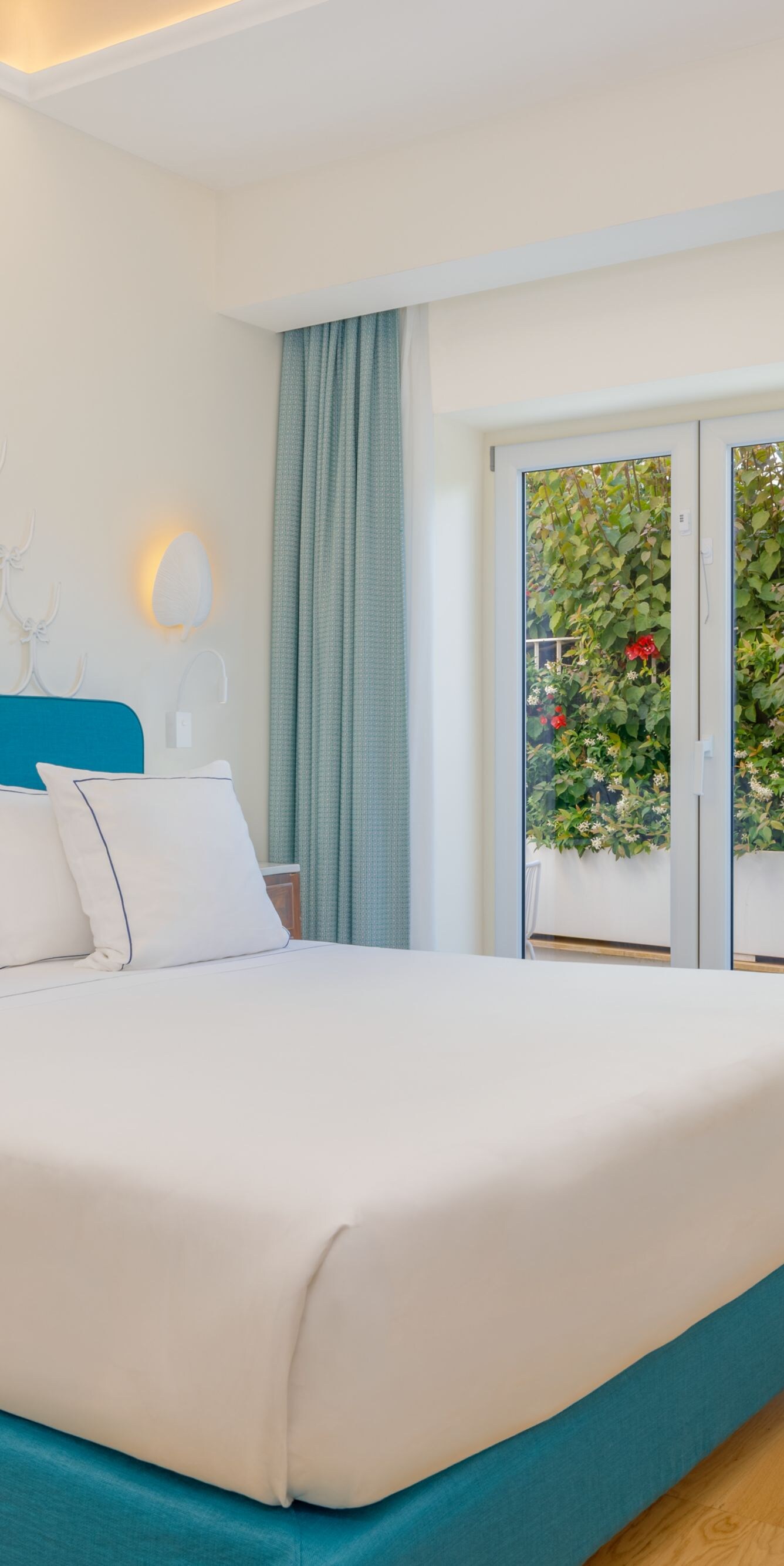 Bright guest room with king bed and garden view