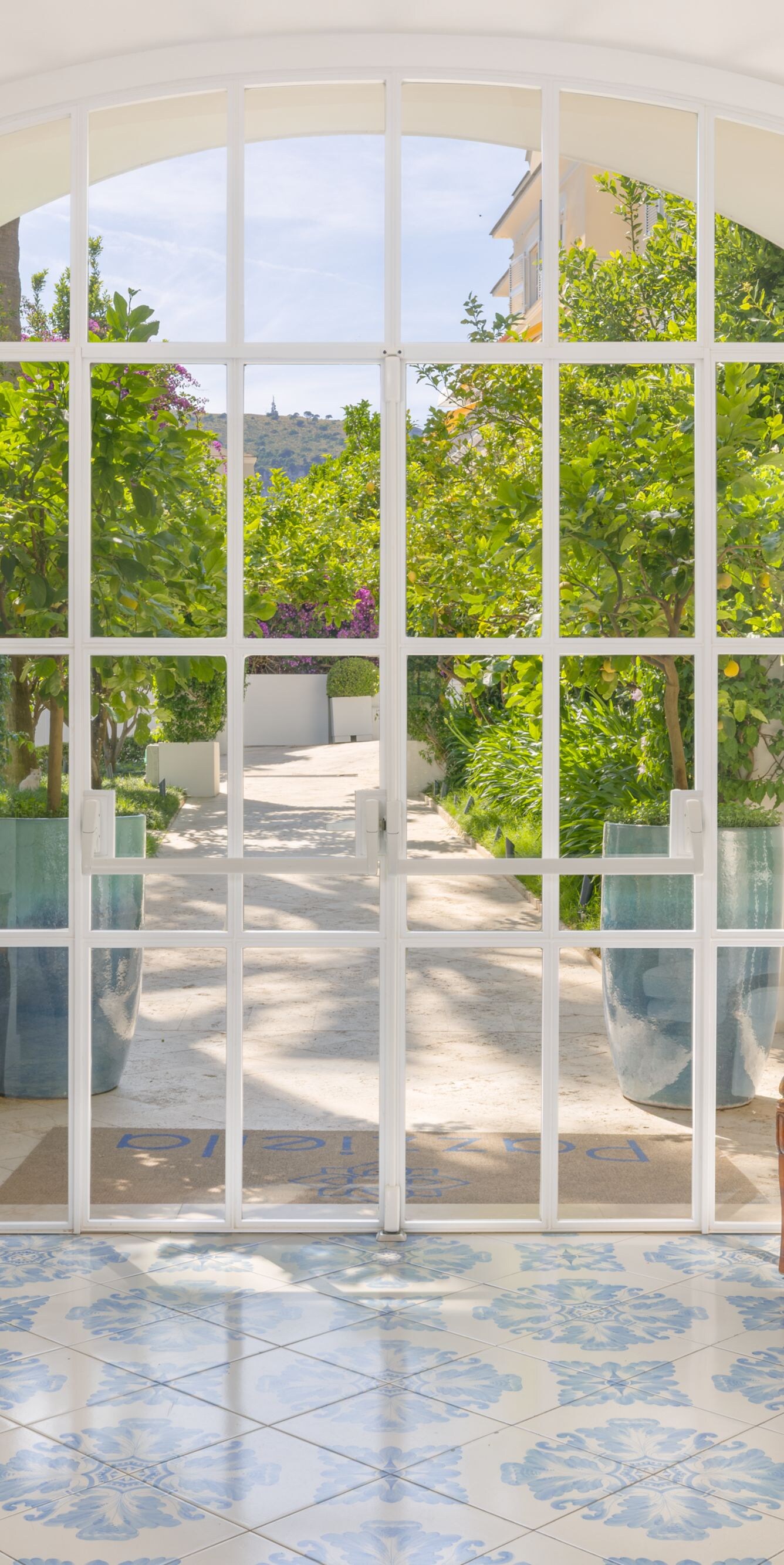 Bright lobby seating area with garden view