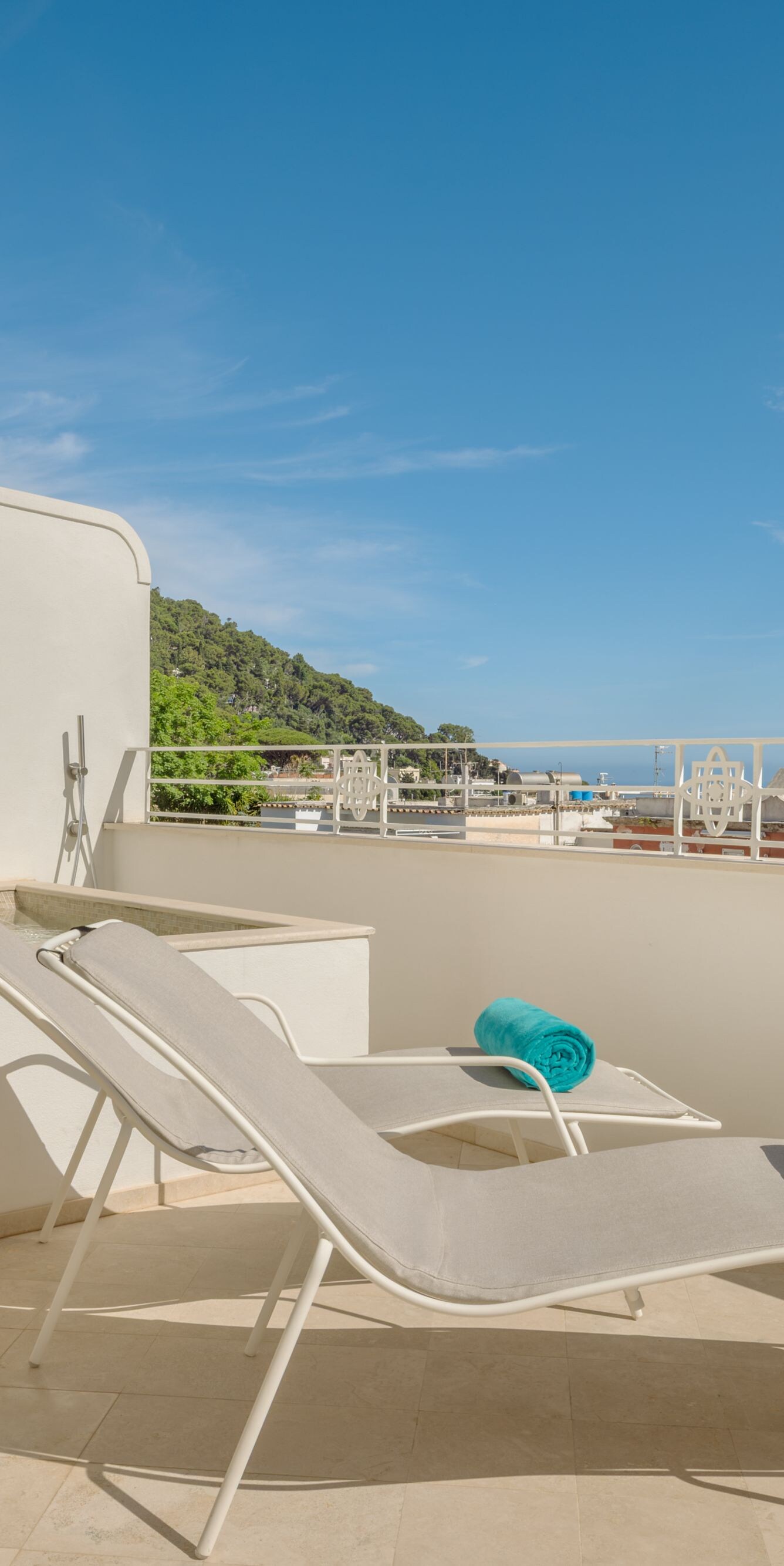 Private terrace with lounge chairs and seating