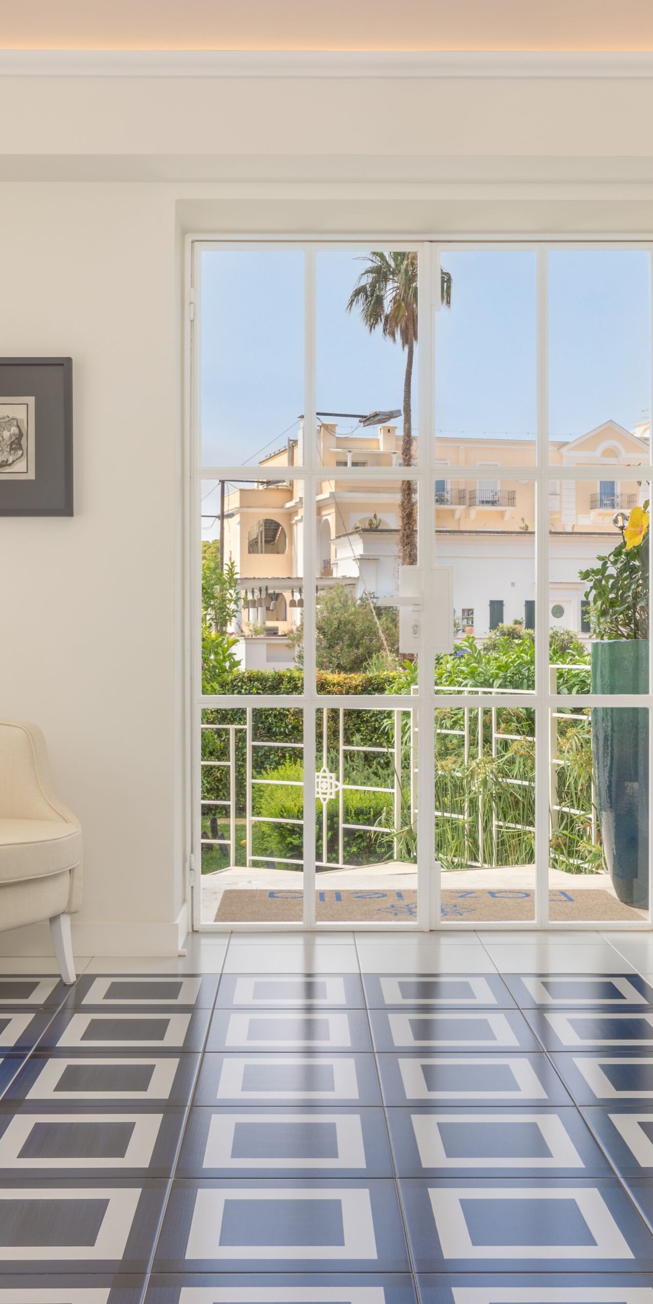 Bright lobby seating area with garden view