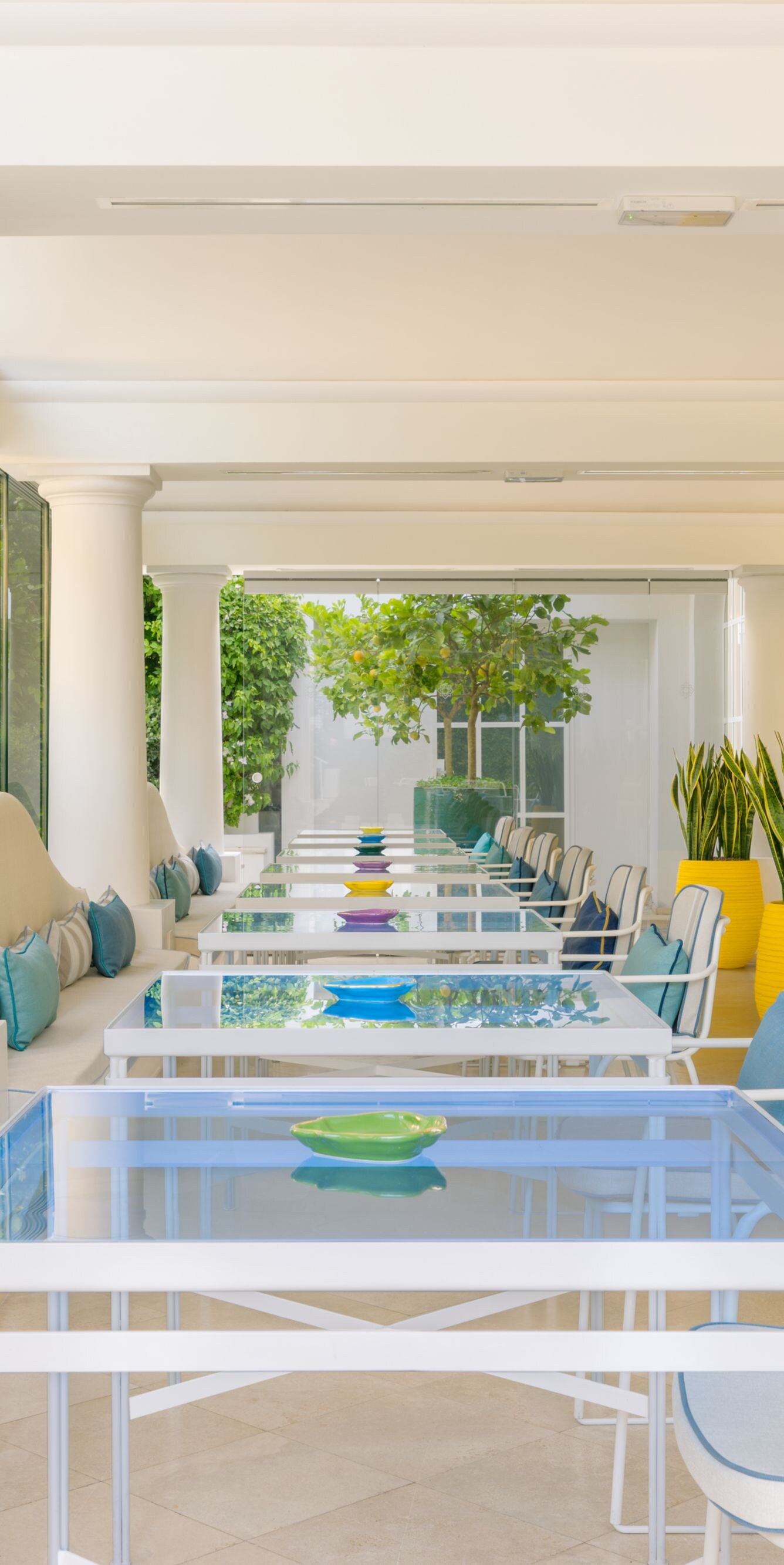 Covered outdoor dining area with tables and chairs