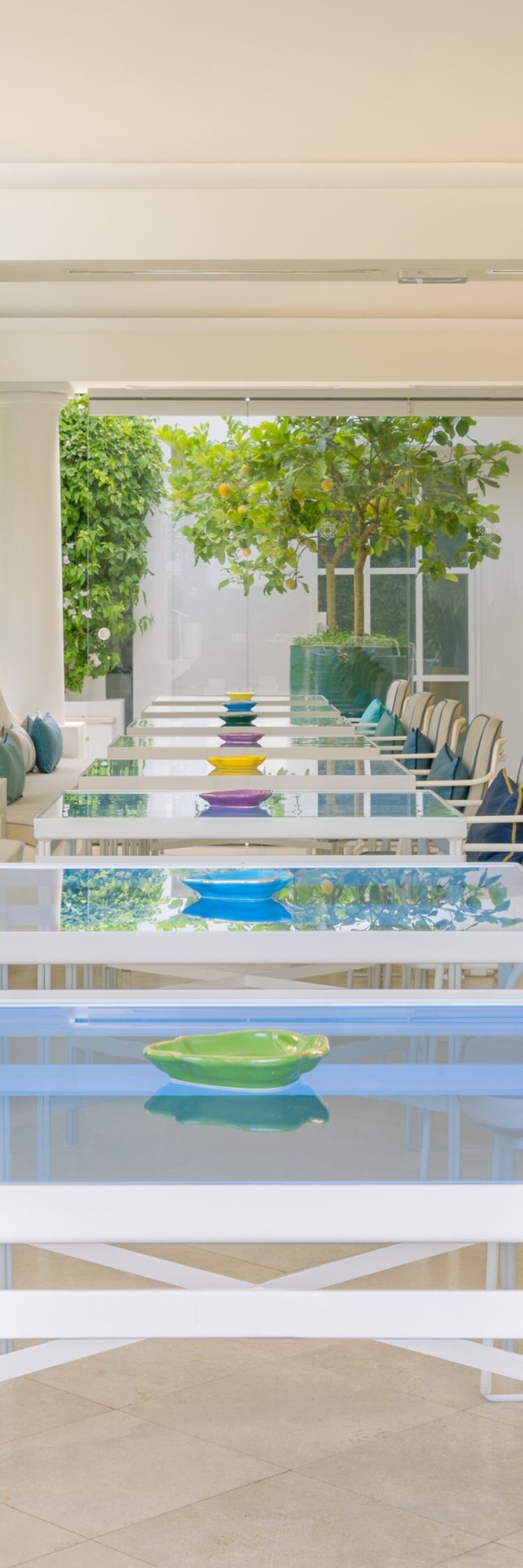 Covered outdoor dining area with tables and chairs