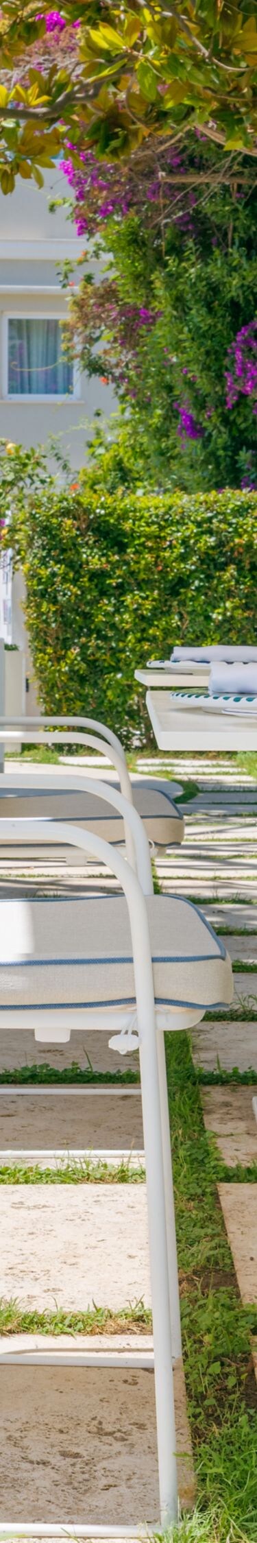 Outdoor garden patio with tables and chairs
