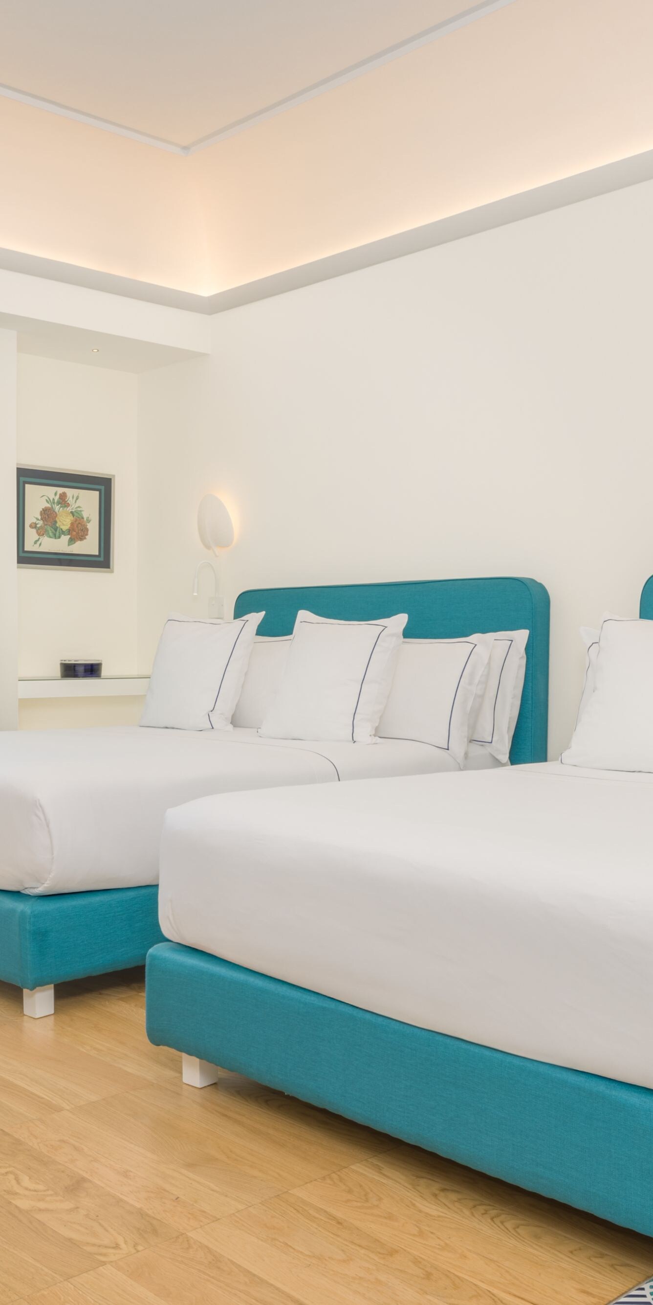Guest room with two beds and balcony access