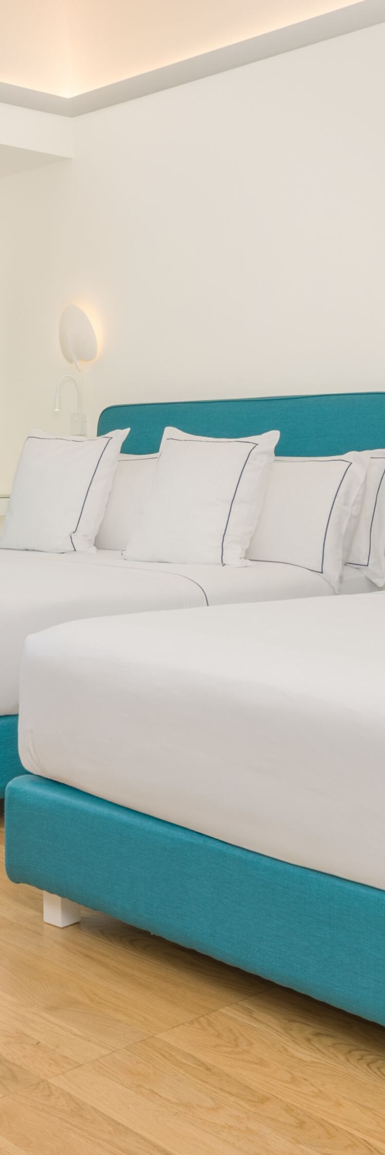 Guest room with two beds and balcony access