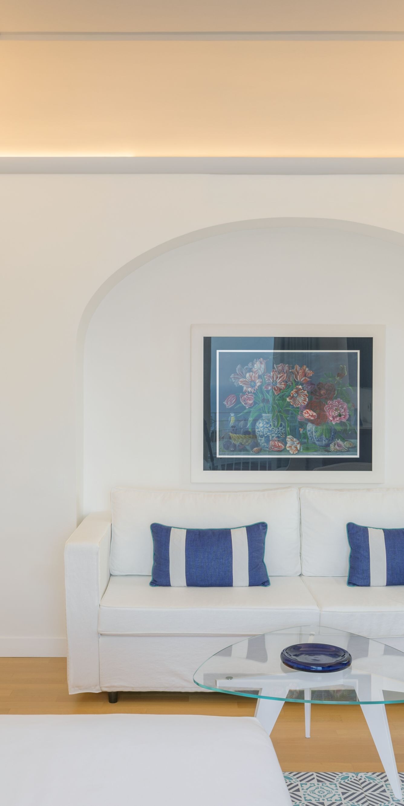 Bright guest suite with sofa, desk and seating 