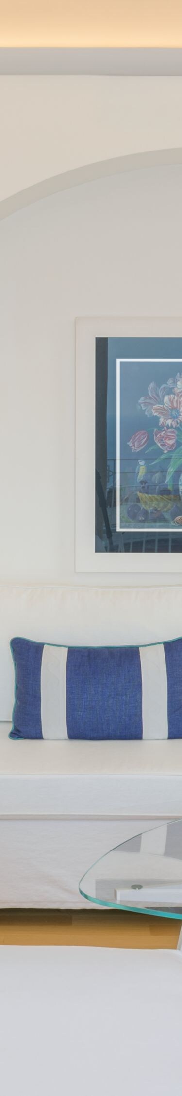Bright guest suite with sofa, desk and seating 