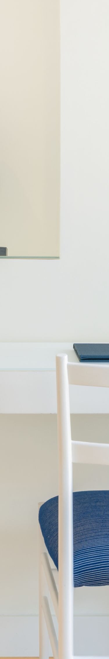 In-room desk with chair, water carafe, and decor