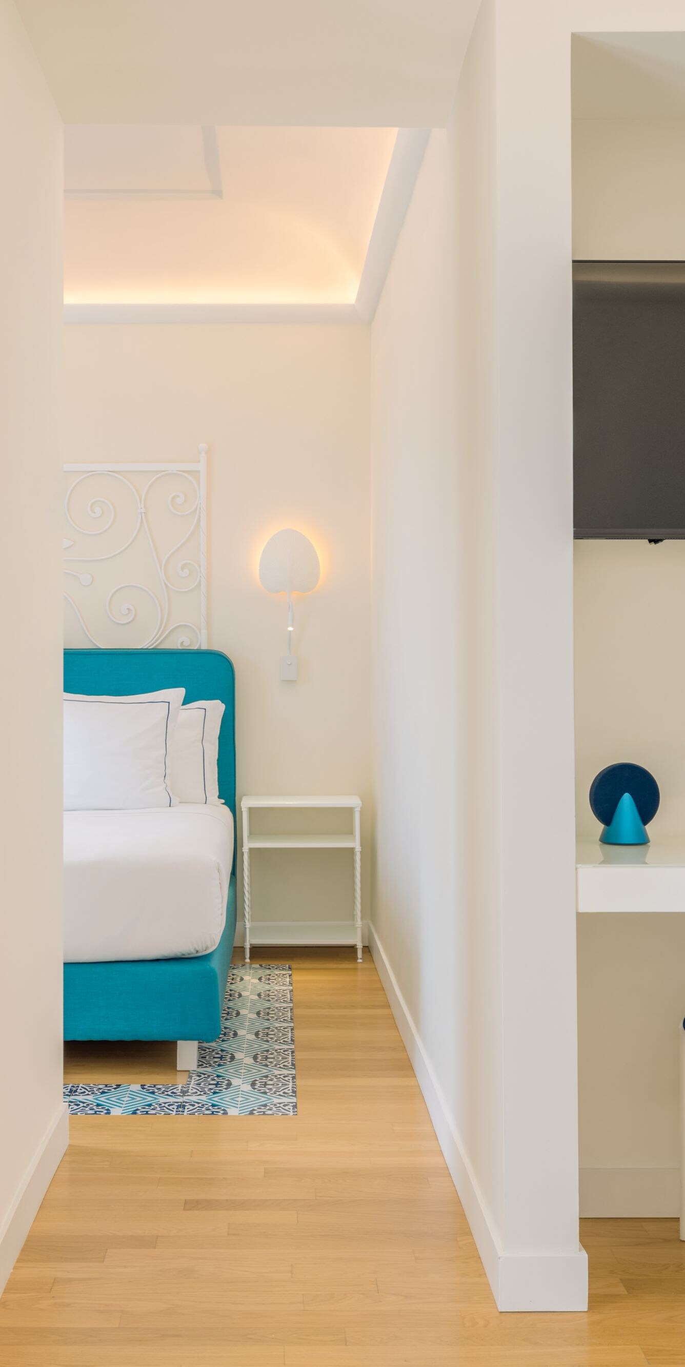 Guest room workspace with TV and bed view