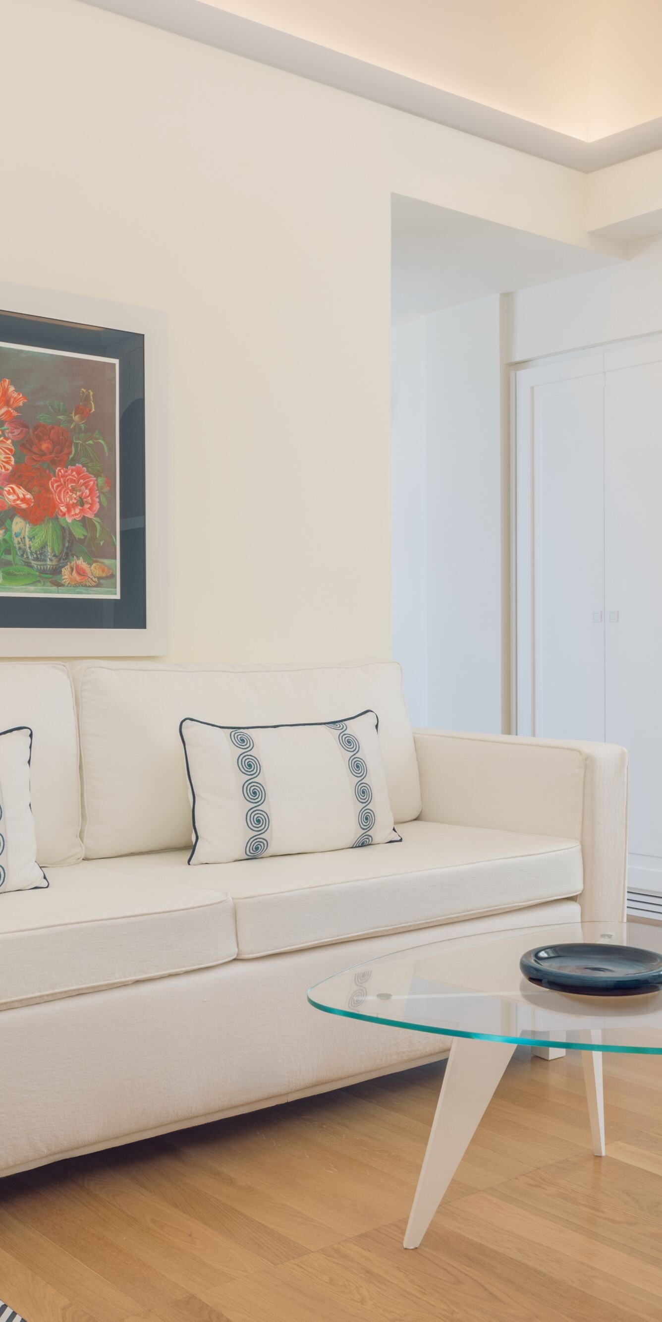 Bright suite living area with balcony access