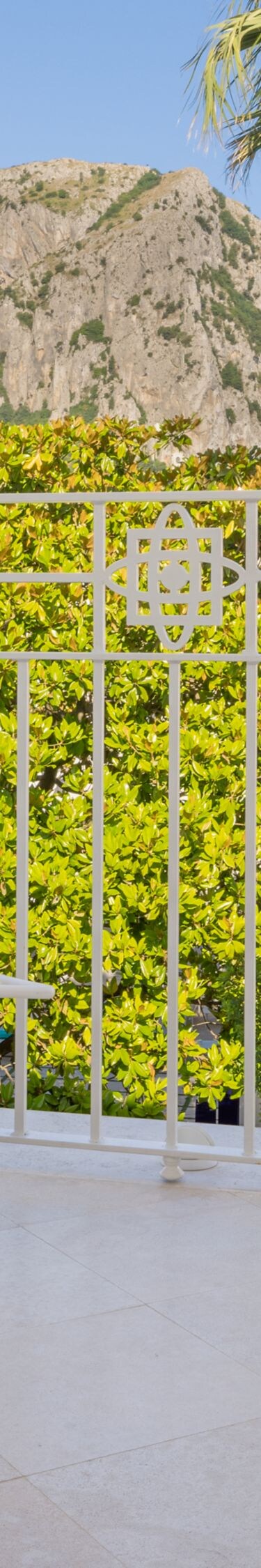 Covered balcony with lounge chairs and views