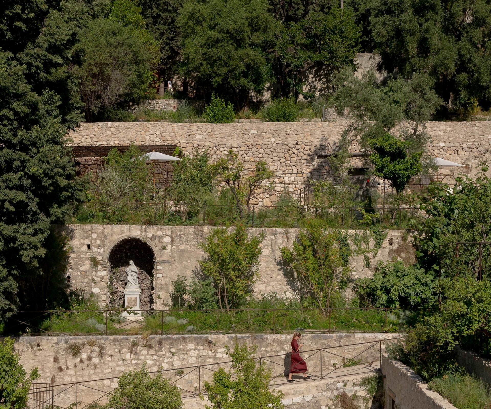 terraced garden with stone and trees