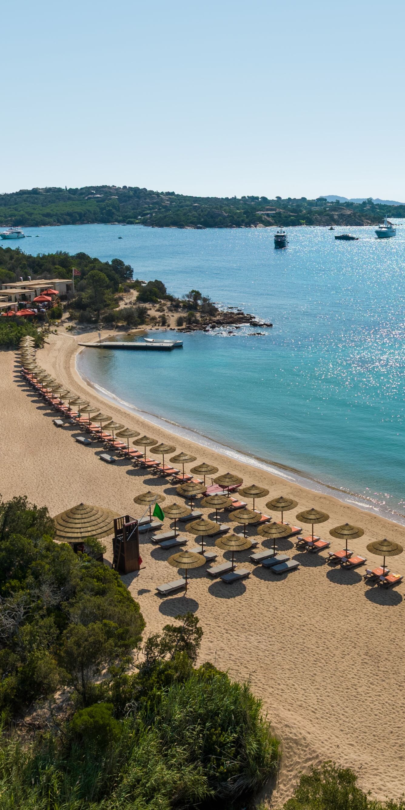 Aerial view of sandy beach and turquoise bay water