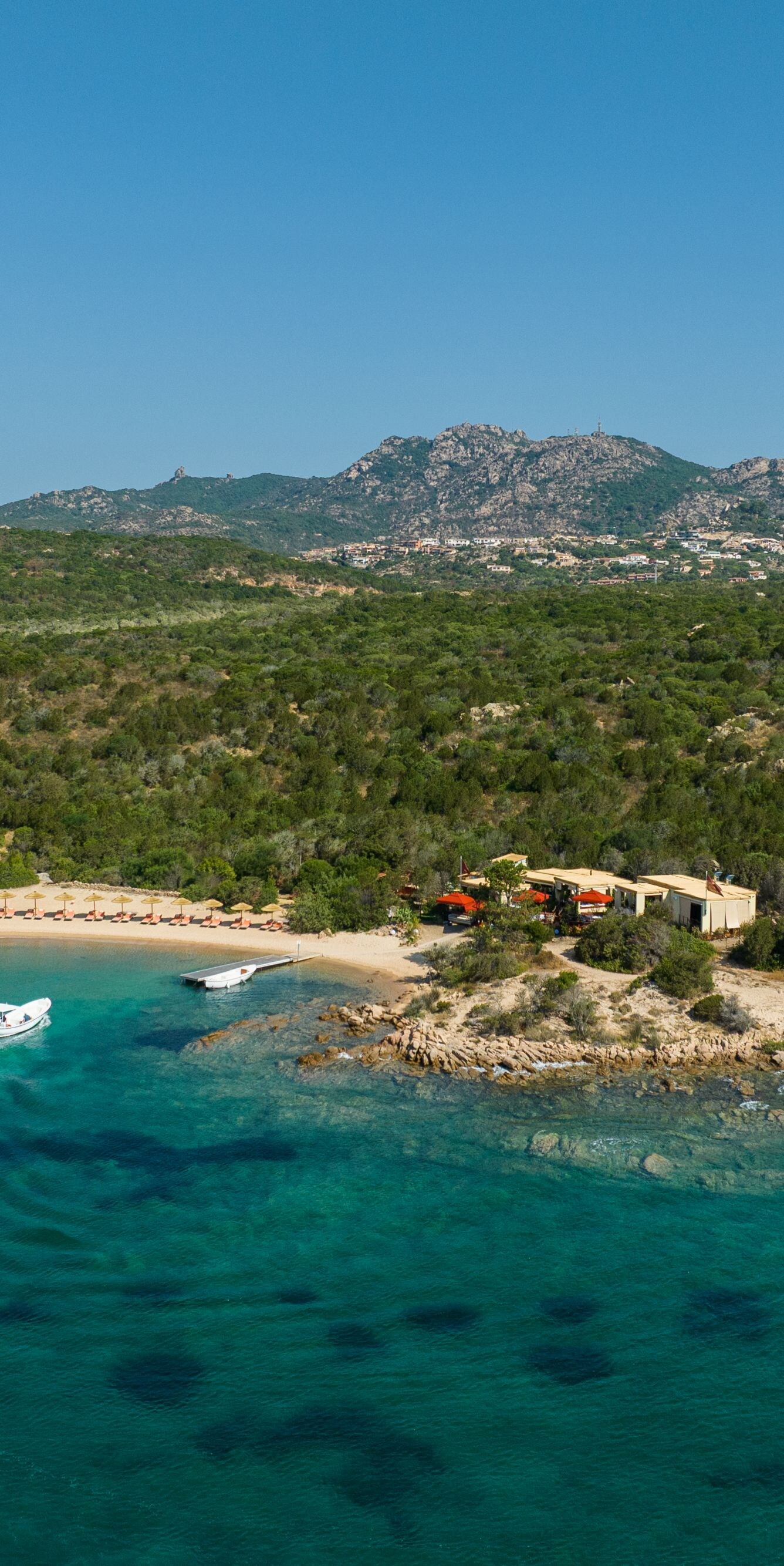 Aerial view of secluded beach and clear water