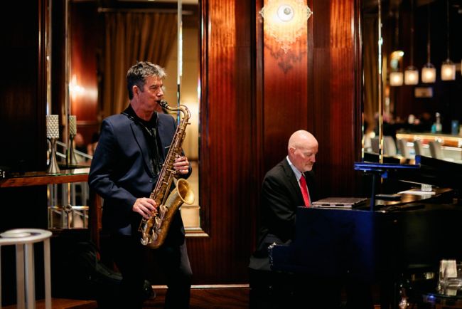 Saxophonist and piano player performing. 