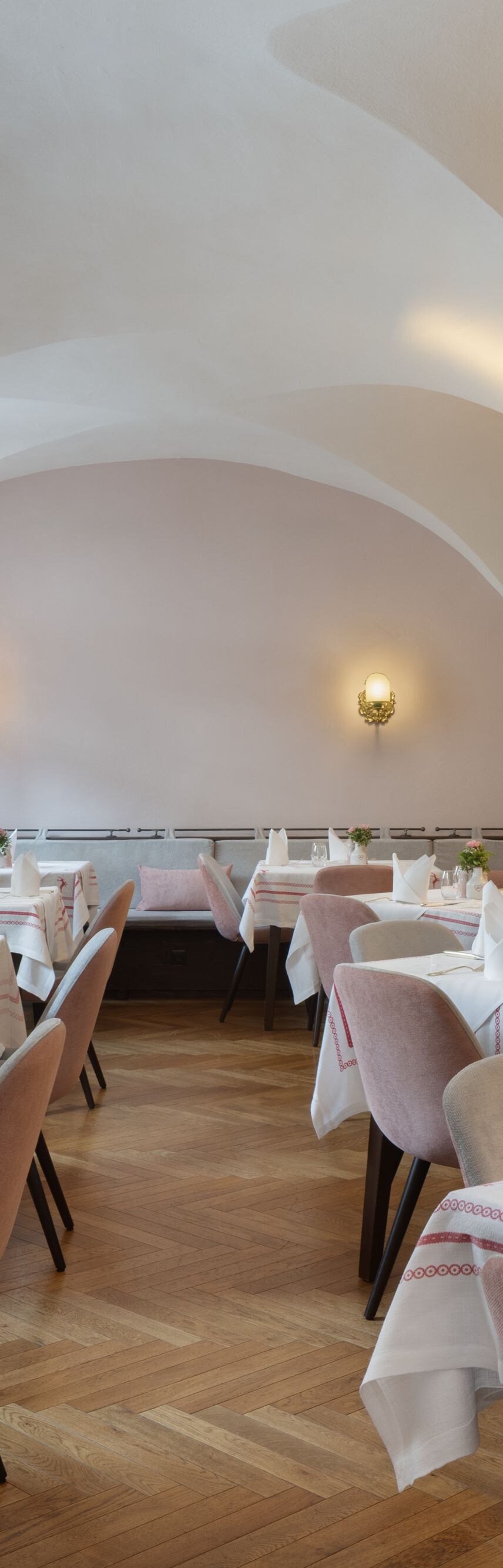 Restaurant with vaulted ceilings and tables