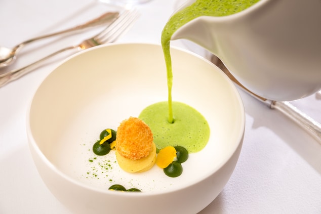 Nettle soup with quail egg and croutons