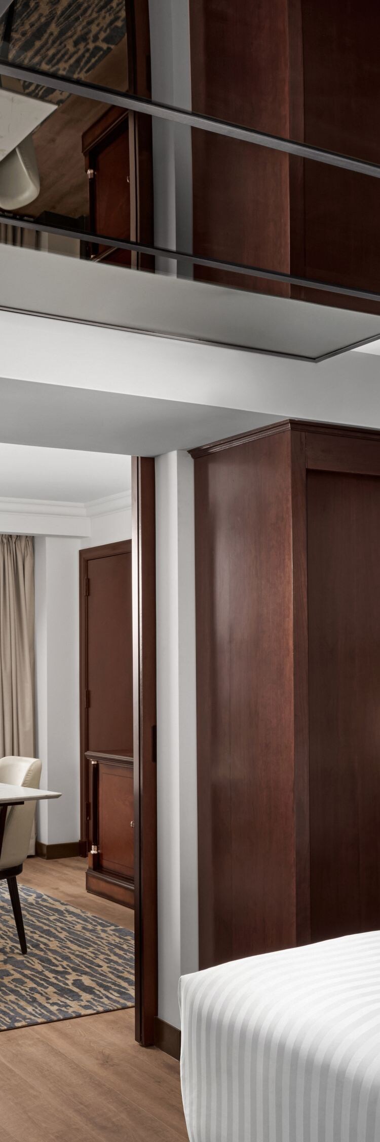 Executive suite with dining area and luxury detail