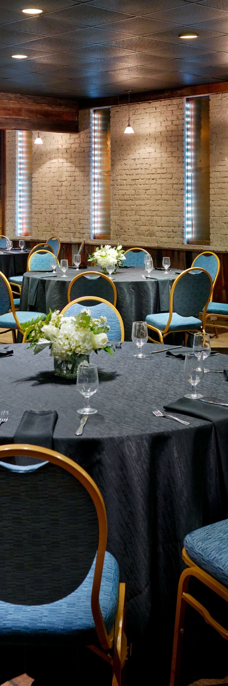 tables and chairs in rounds of 8 for meal