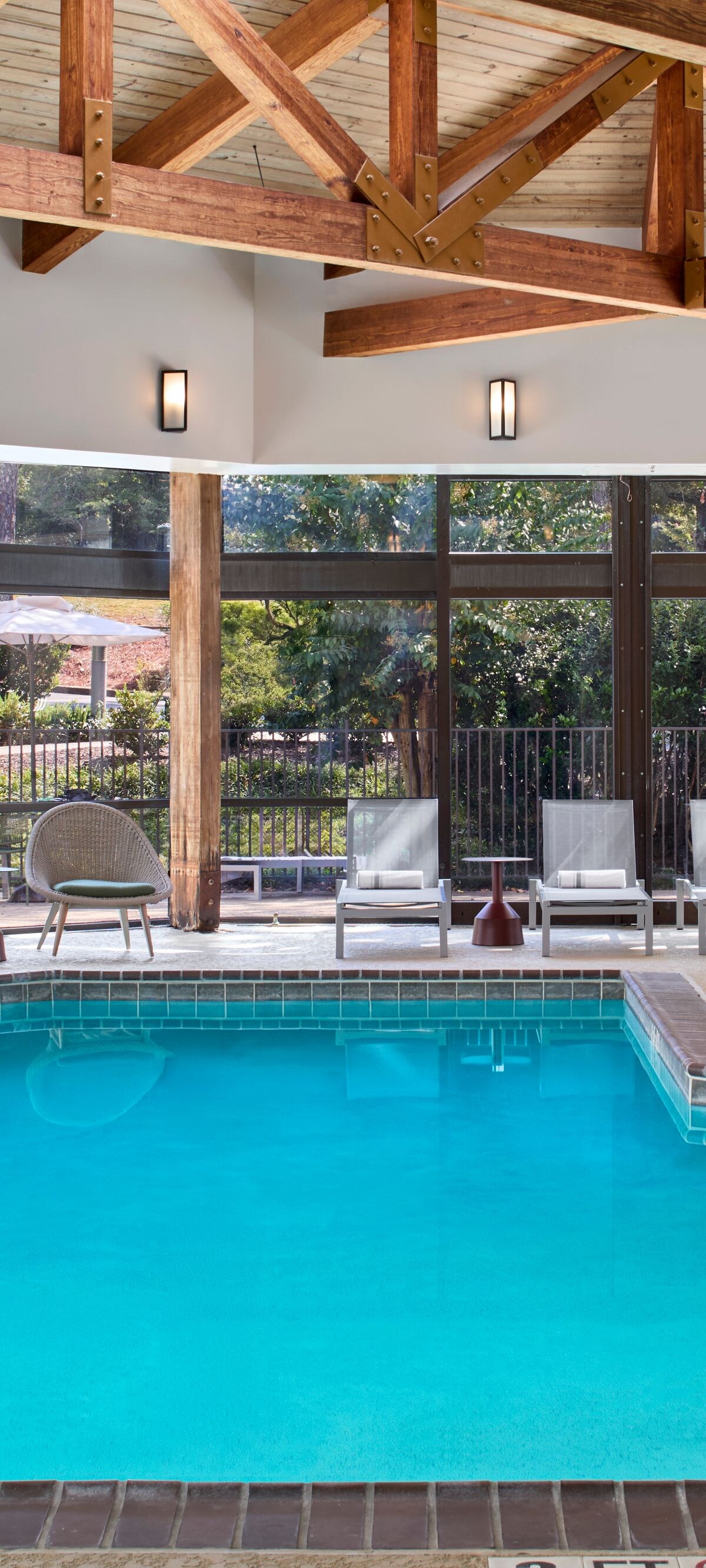 Indoor Pool with Loungers and outdoor patio chairs