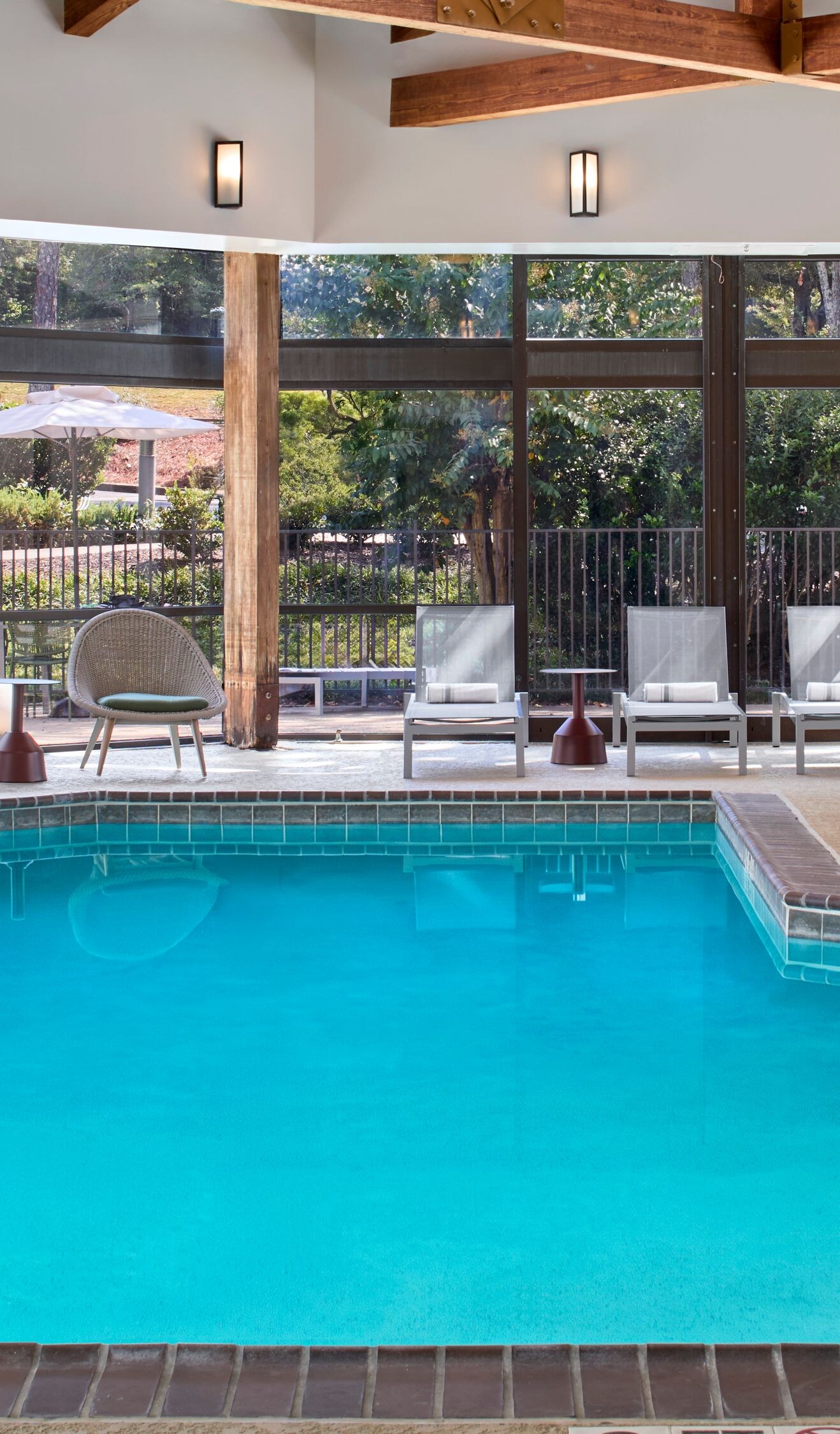 Indoor Pool with Loungers and outdoor patio chairs