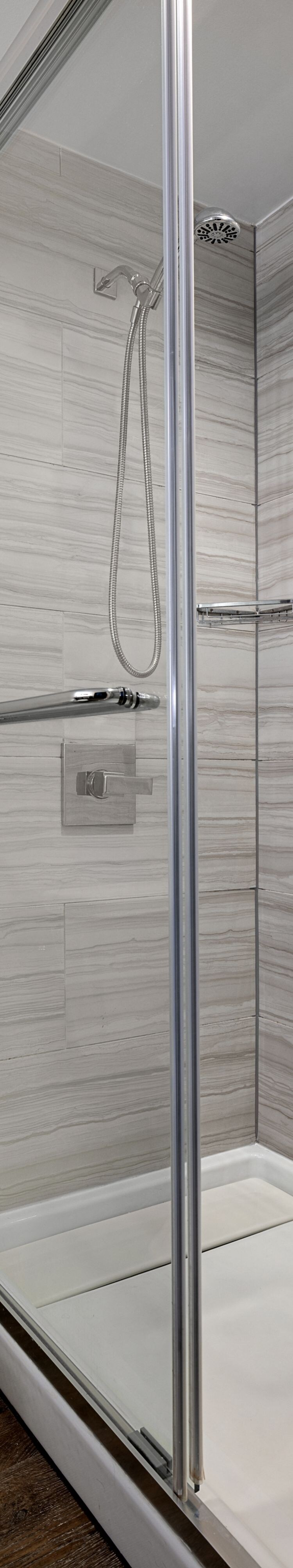 walk-in shower with glass doors
