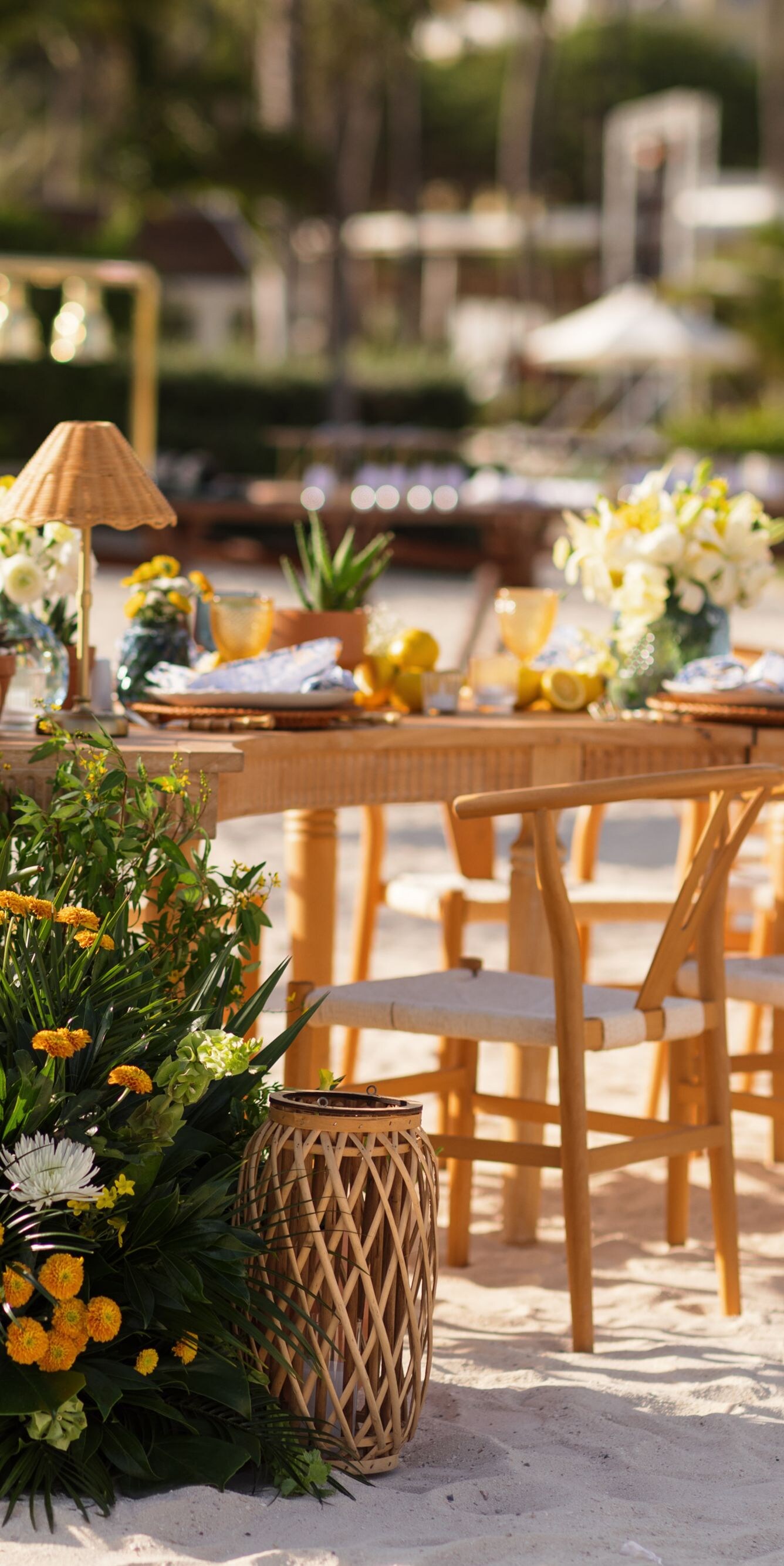 Beachfront wedding reception setup on white sand
