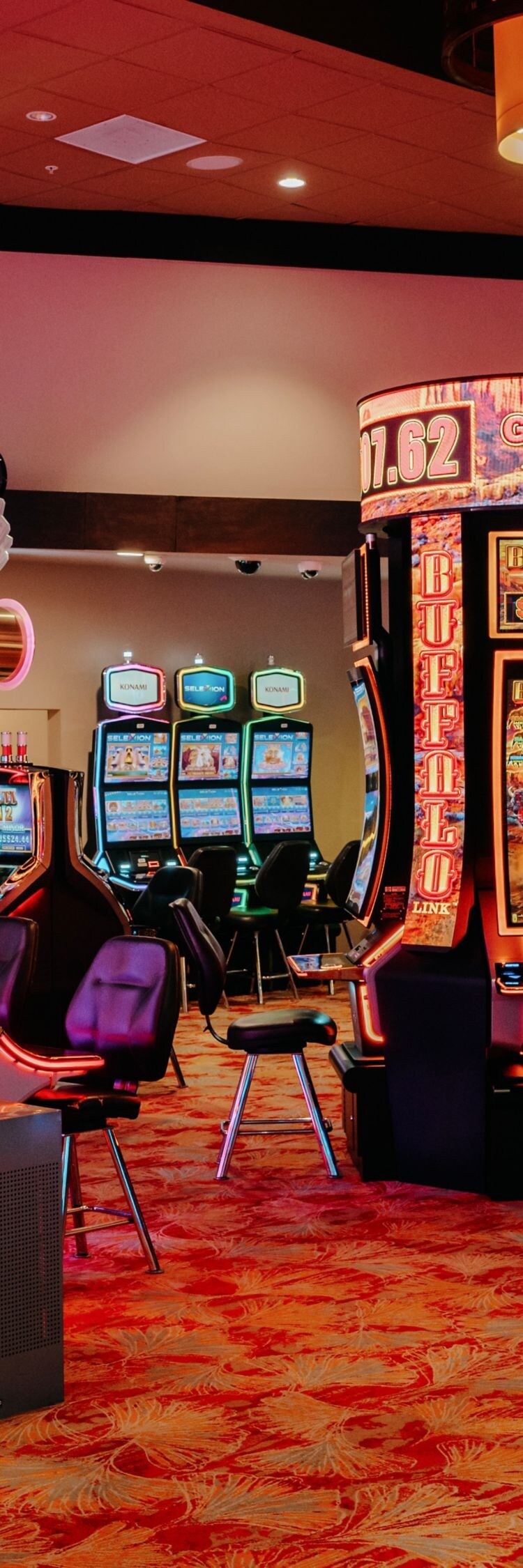 Casino floor with rows of modern slot machines