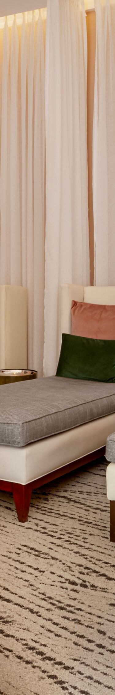 Spa lounge with chaise lounges and curtains