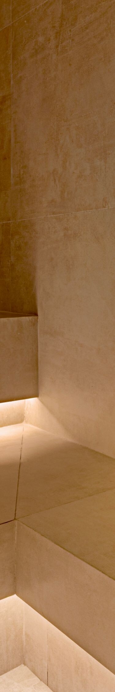 Steam room with stone bench and towels