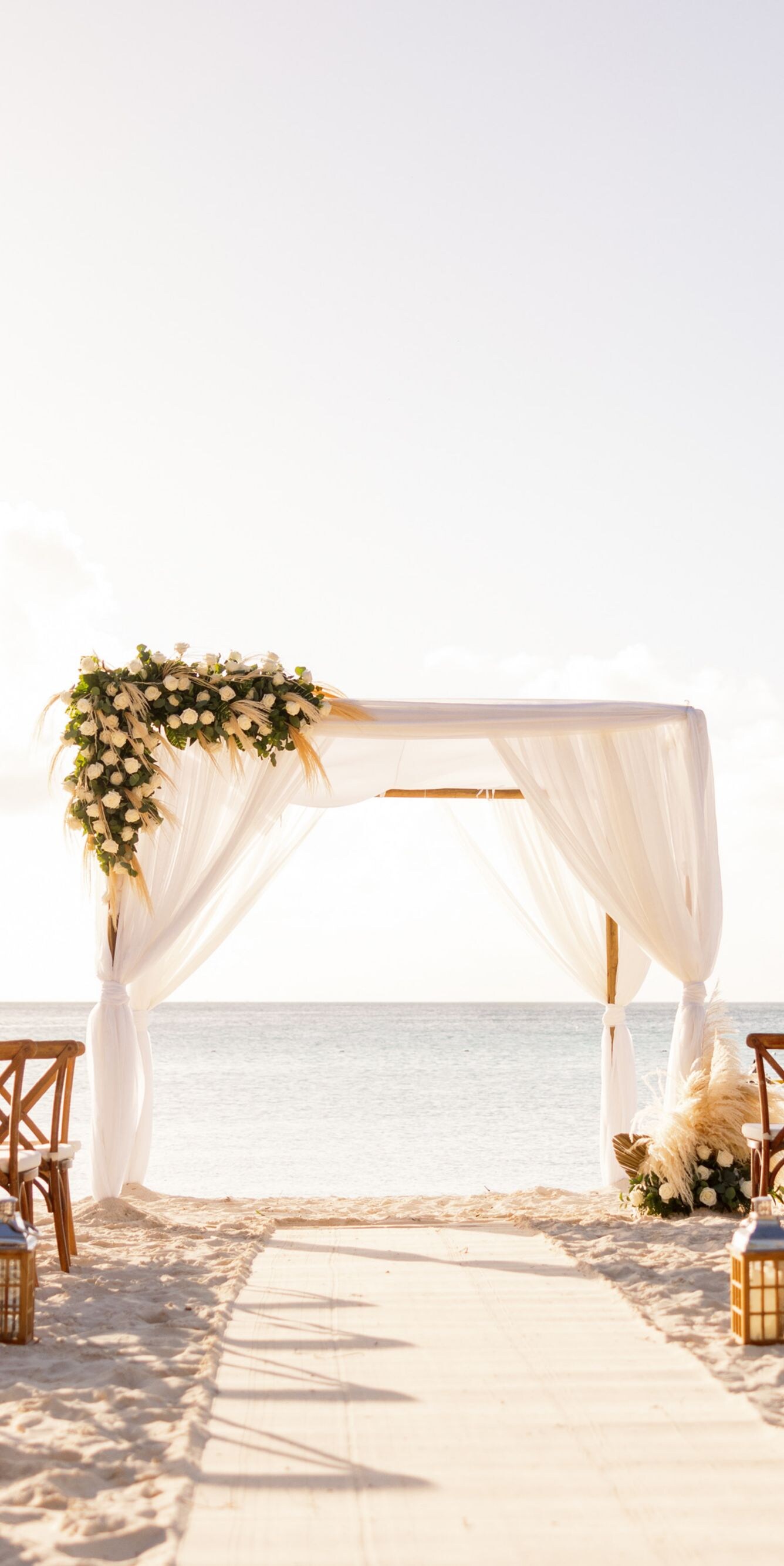 Beach wedding ceremony setup on a sandy beach
