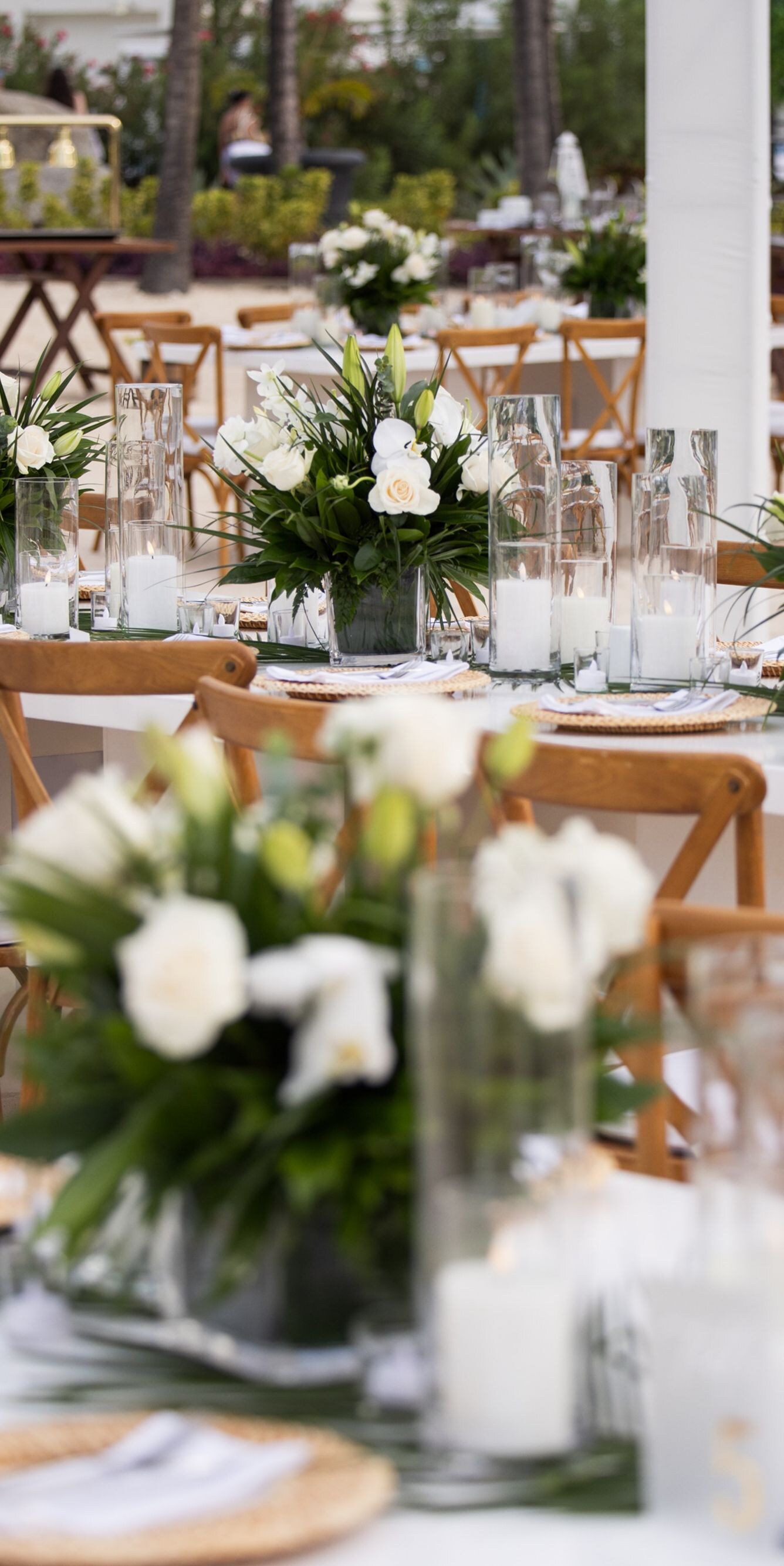 Beachfront reception tables arranged on the sand