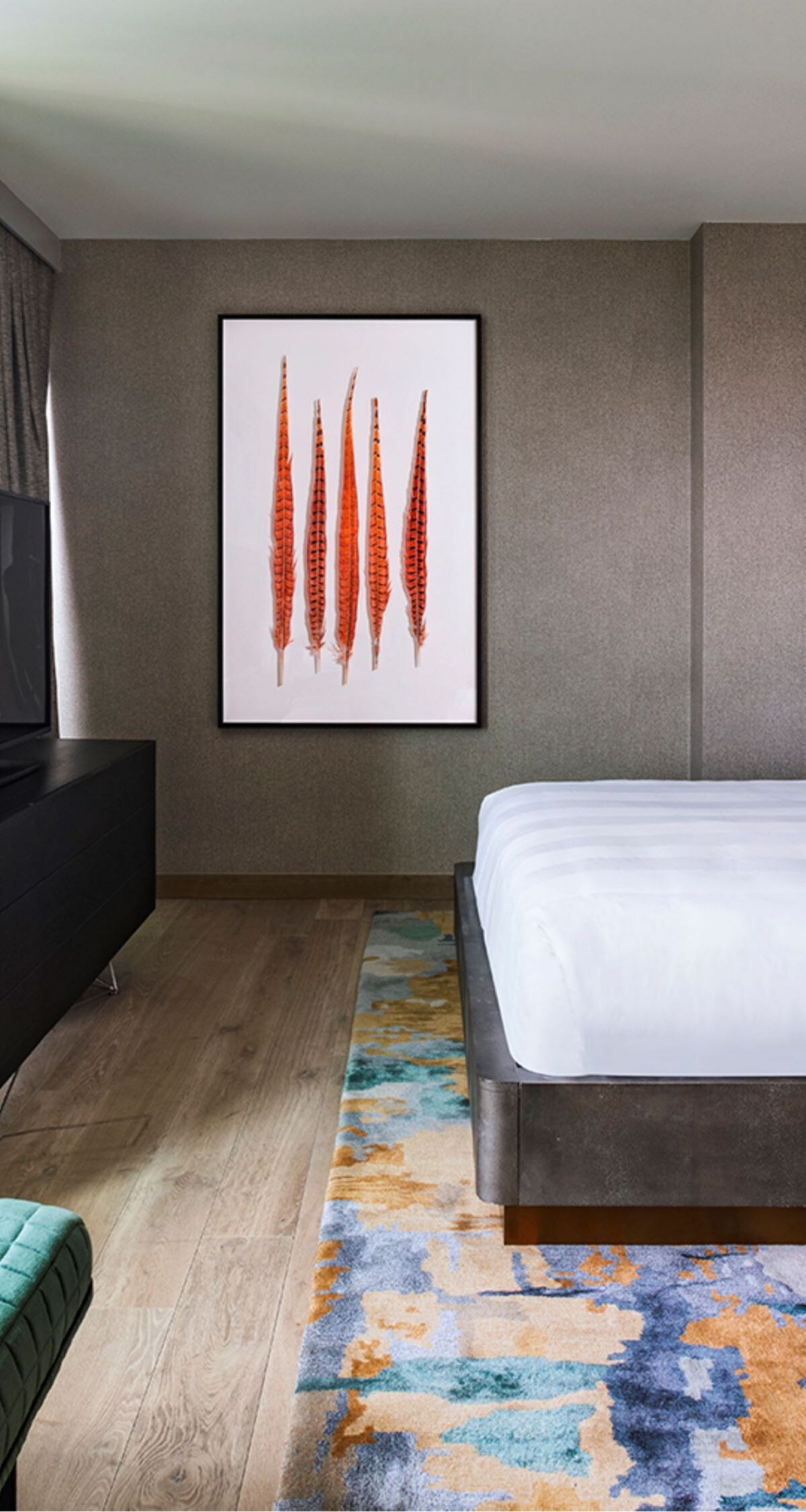 Large bedroom with tv and king sized bed