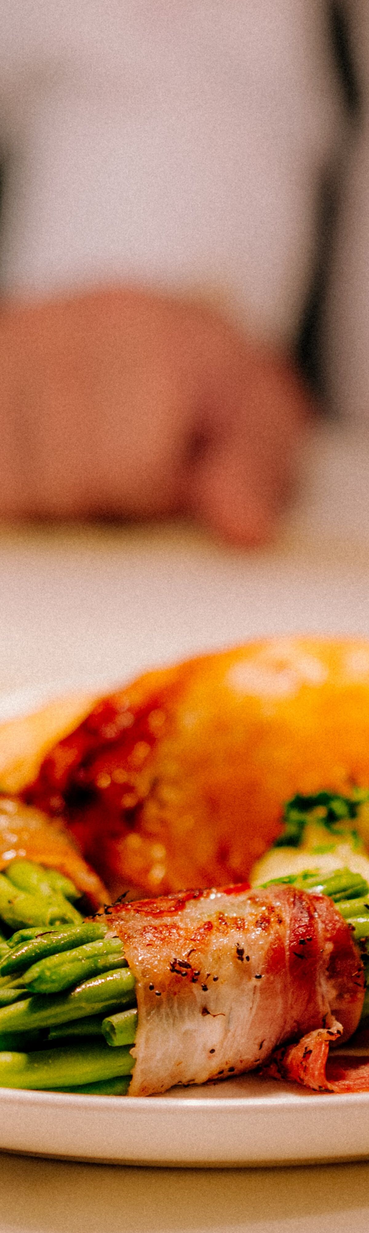 Chicken with mashed potatoes, bacon‑wrapped beans,