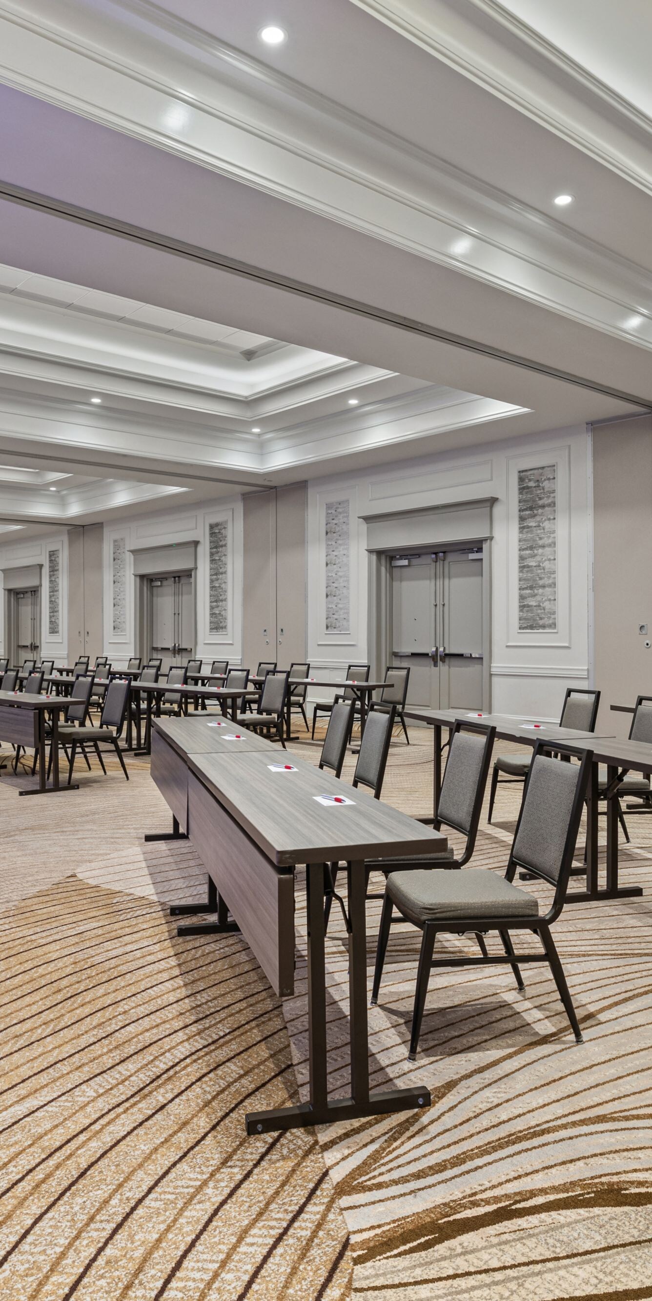 meeting room with long tables and chairs