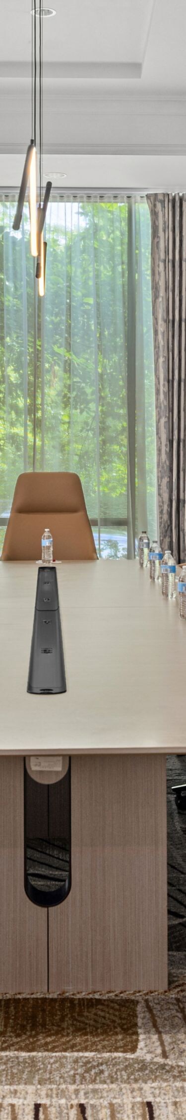 boardroom table with chairs on both sides