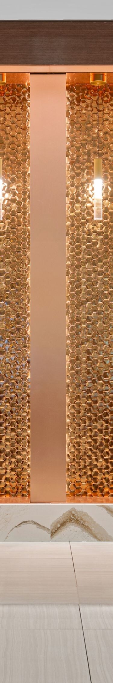 Lobby front desk area with accent gold wall
