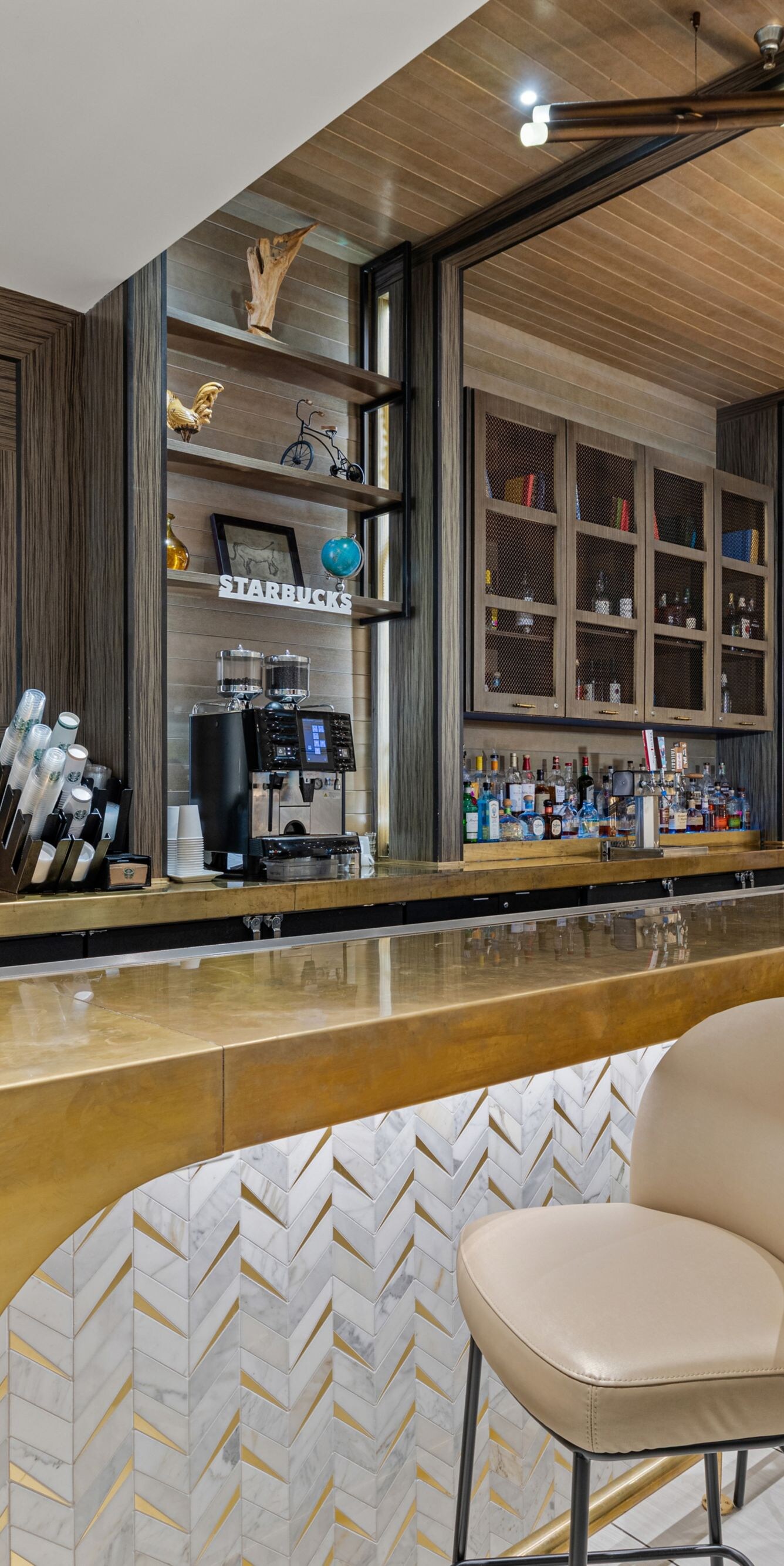 bar with chairs and coffee maker