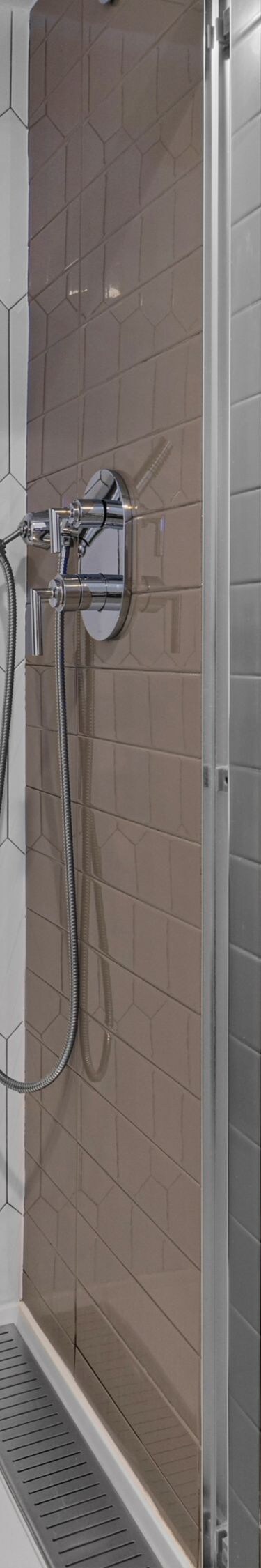 Guest bathroom with glass shower and vanity
